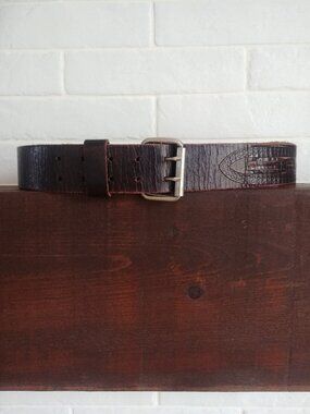 Men's wide weathered brown leather belt with silver buckle and cutout detail